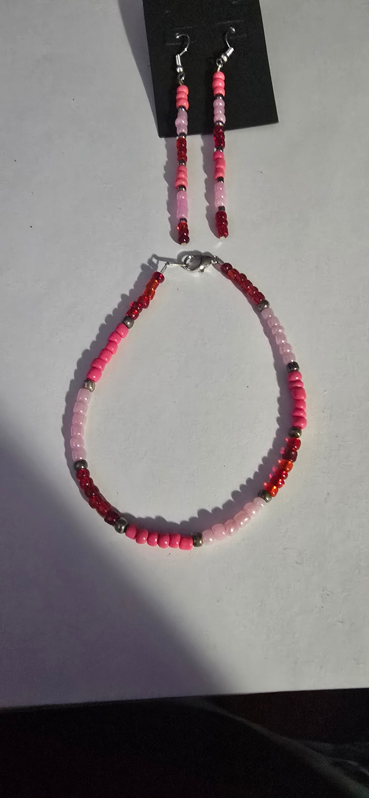 pink earring with bracelets