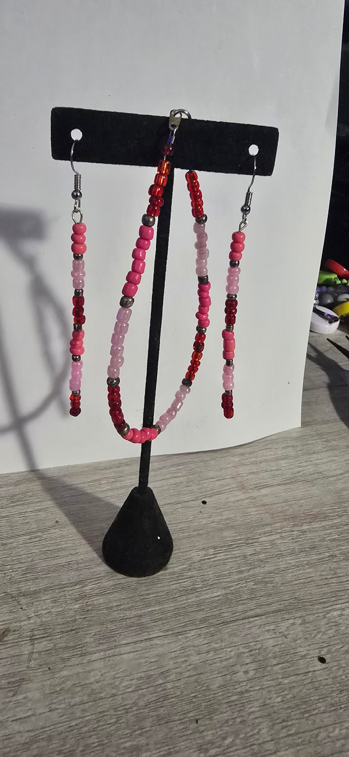 pink earring with bracelets